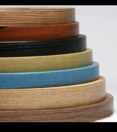 Stack of colourful PVC edge-banding rolls